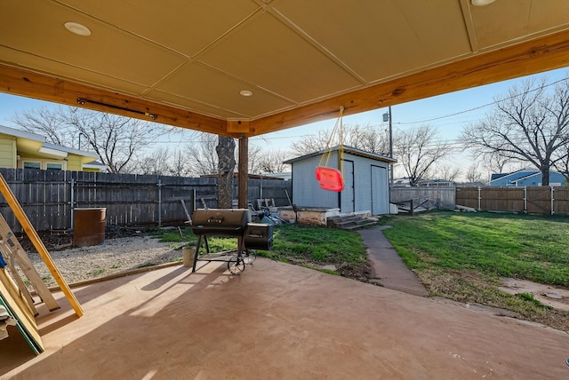 view of patio / terrace featuring a shed and grilling area