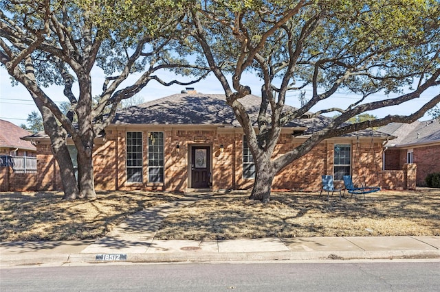 view of front of home featuring brick siding