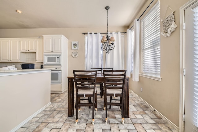 dining room with a chandelier