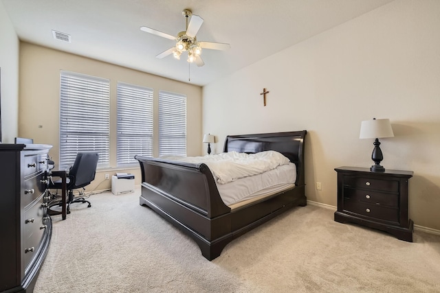 bedroom with light carpet and ceiling fan