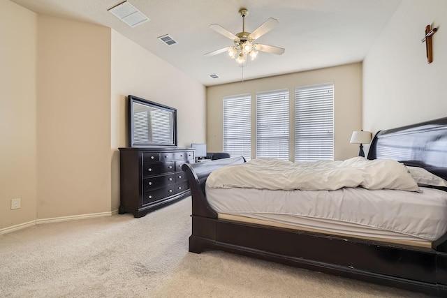 carpeted bedroom with lofted ceiling and ceiling fan