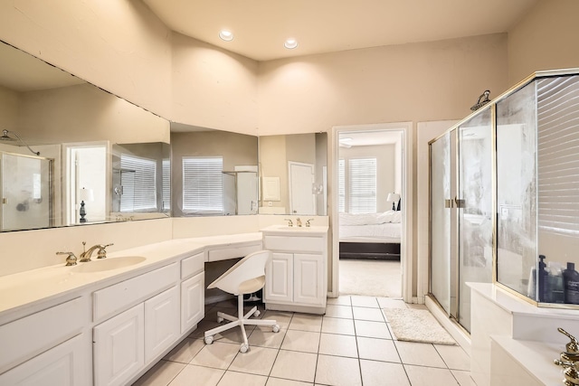 bathroom featuring tile patterned flooring, vanity, and walk in shower