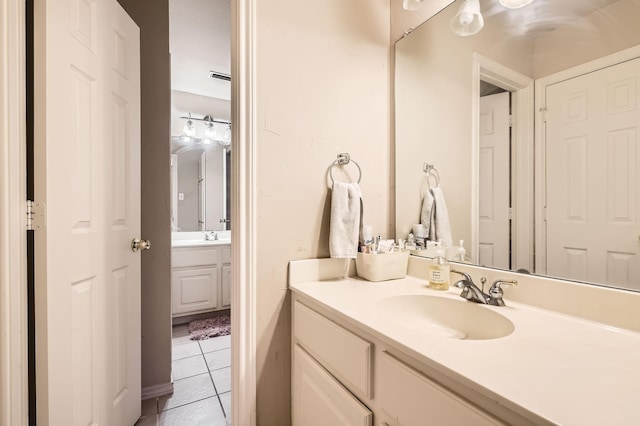 bathroom featuring vanity and tile patterned flooring