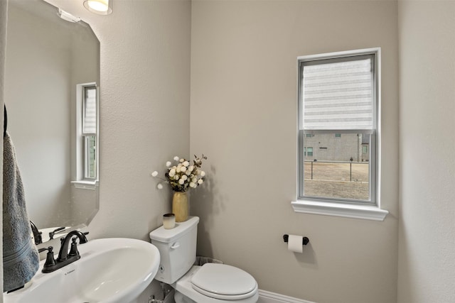 bathroom with sink and toilet