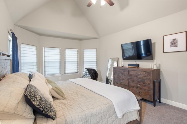 carpeted bedroom with ceiling fan and high vaulted ceiling