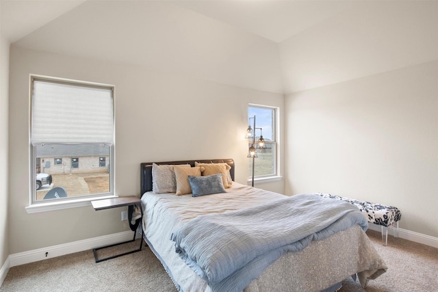 bedroom with lofted ceiling and carpet