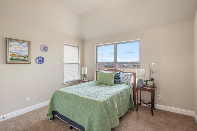 bedroom with vaulted ceiling and carpet