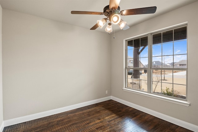 unfurnished room with dark hardwood / wood-style flooring