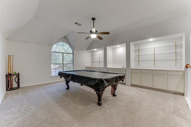 recreation room with sink, pool table, vaulted ceiling, a textured ceiling, and light colored carpet