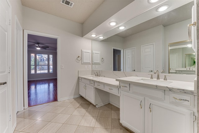 bathroom featuring vanity, tile patterned floors, and ceiling fan