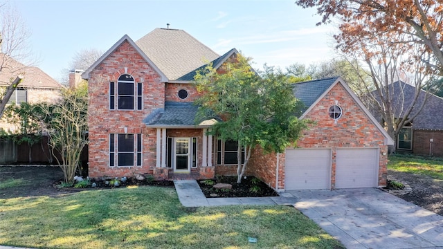 view of front facade featuring a garage and a front yard