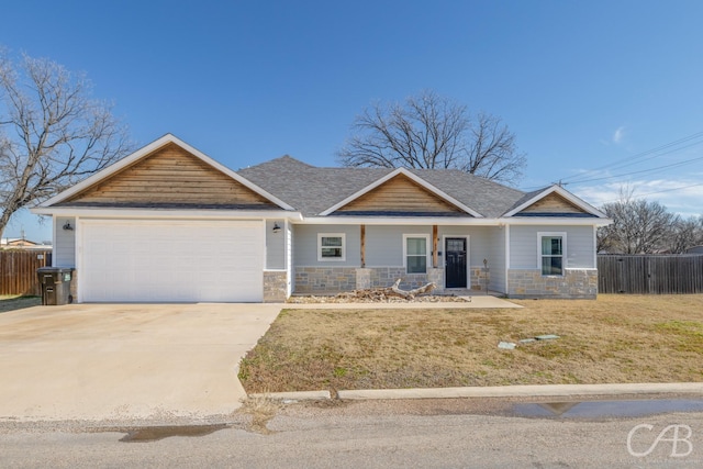 craftsman-style home with a garage and a front yard