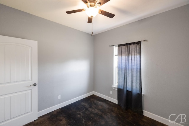 spare room with ceiling fan