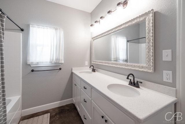 bathroom with vanity and shower / bathing tub combination