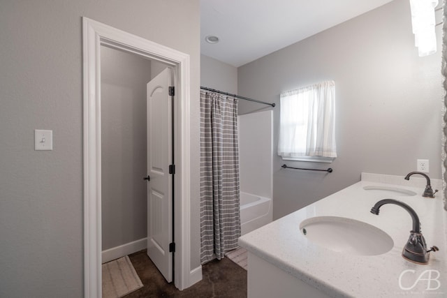 bathroom with vanity and shower / bath combination with curtain