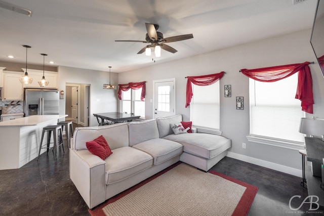 living room featuring ceiling fan