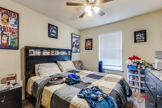 bedroom with ceiling fan and carpet floors