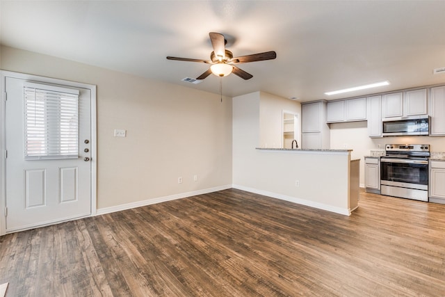 kitchen featuring white cabinets, light wood-type flooring, ceiling fan, and appliances with stainless steel finishes