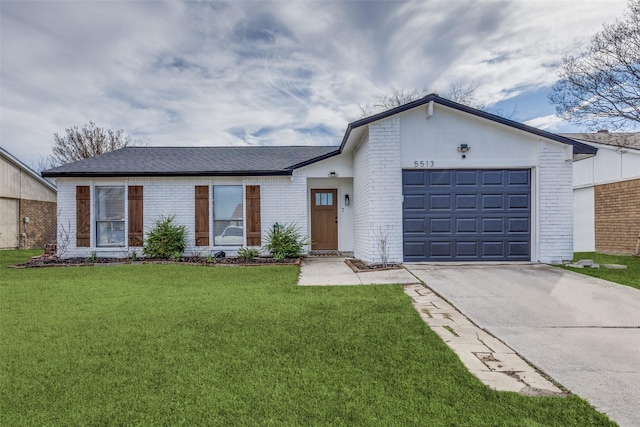 ranch-style house featuring a garage and a front lawn