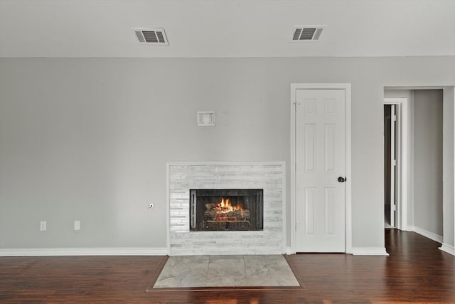 unfurnished living room with dark hardwood / wood-style flooring