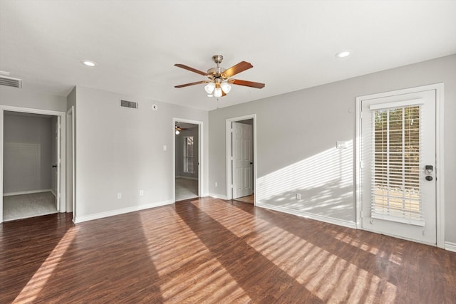 unfurnished sunroom featuring vaulted ceiling, baseboards, a wealth of natural light, and carpet flooring