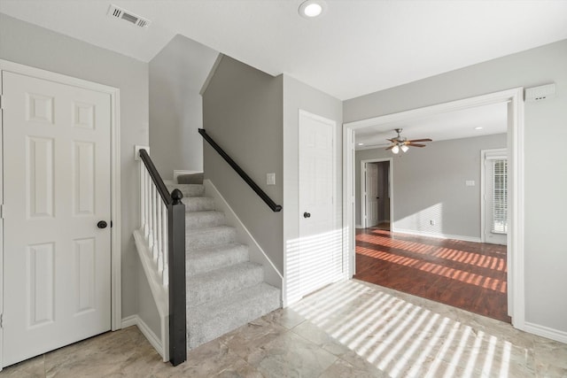 staircase featuring baseboards, visible vents, recessed lighting, and ceiling fan