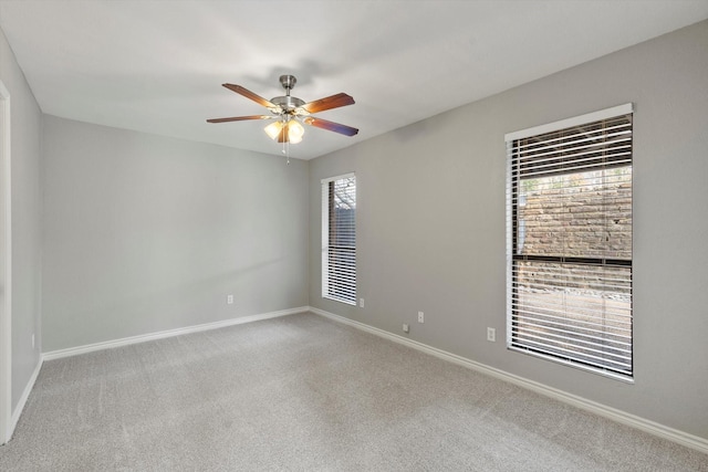 unfurnished room with ceiling fan and carpet flooring