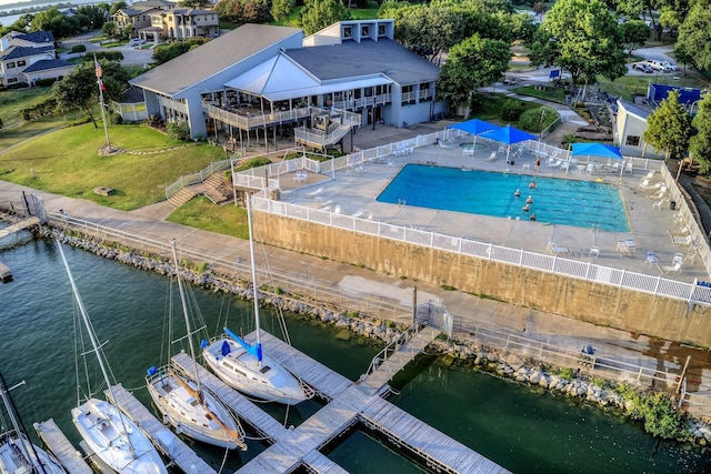 birds eye view of property with a water view