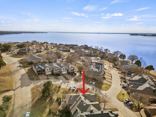 aerial view featuring a residential view and a water view