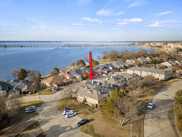 aerial view with a residential view and a water view