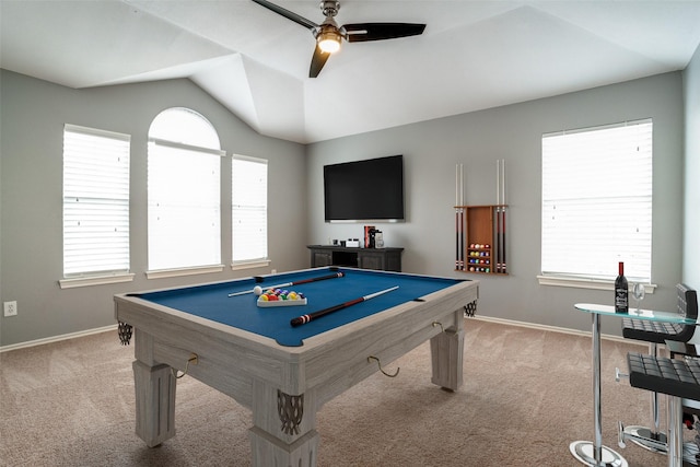 recreation room featuring vaulted ceiling, carpet flooring, and a wealth of natural light