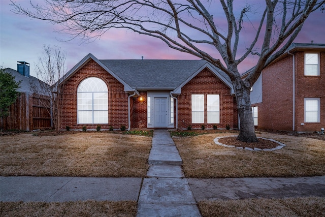 view of front of home featuring a yard