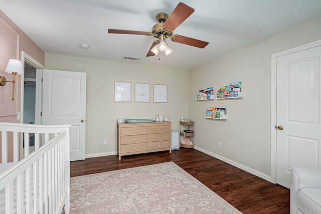 bedroom with dark wood-type flooring and ceiling fan