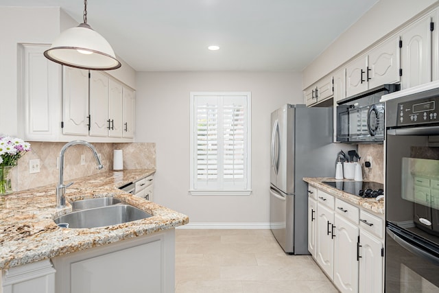 kitchen featuring pendant lighting, white cabinets, and black appliances