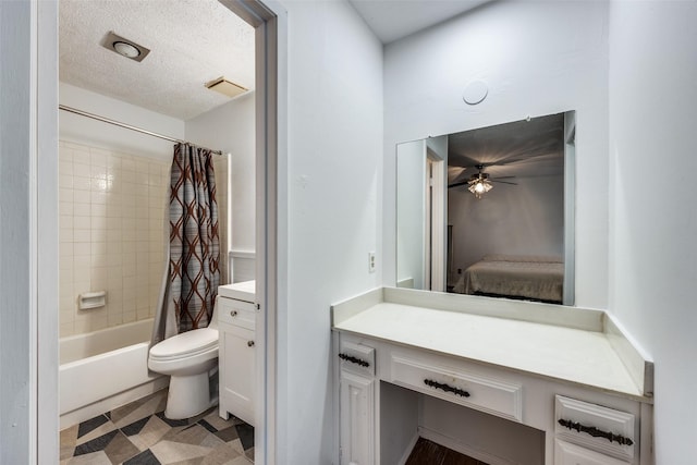 full bathroom featuring vanity, shower / tub combo, a textured ceiling, and toilet