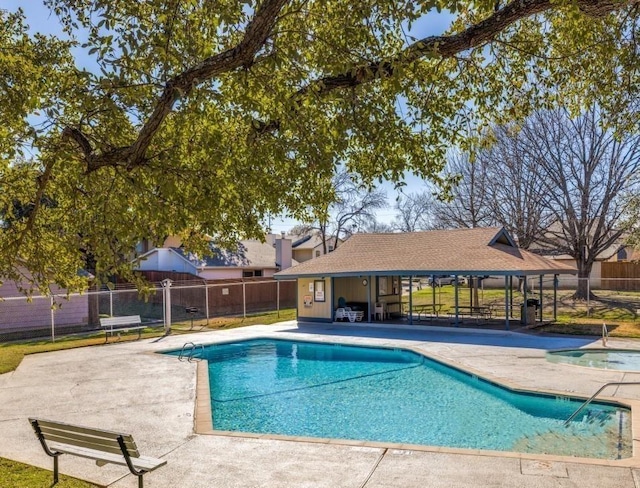 view of swimming pool with a gazebo and a patio area