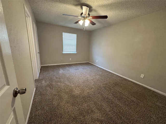 spare room featuring ceiling fan, a textured ceiling, and dark colored carpet