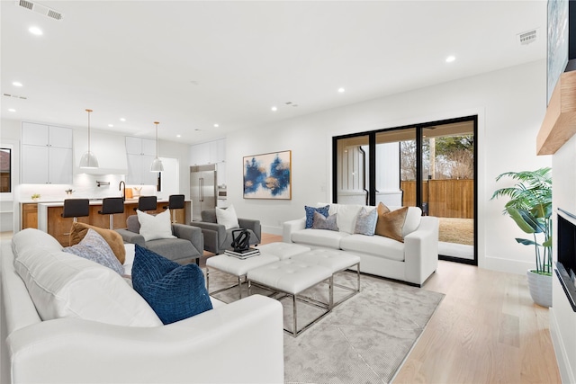 living room featuring light wood-type flooring