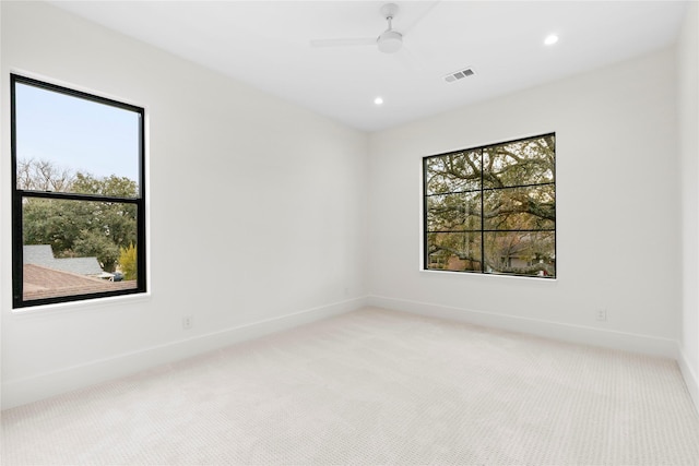 empty room with light carpet and ceiling fan