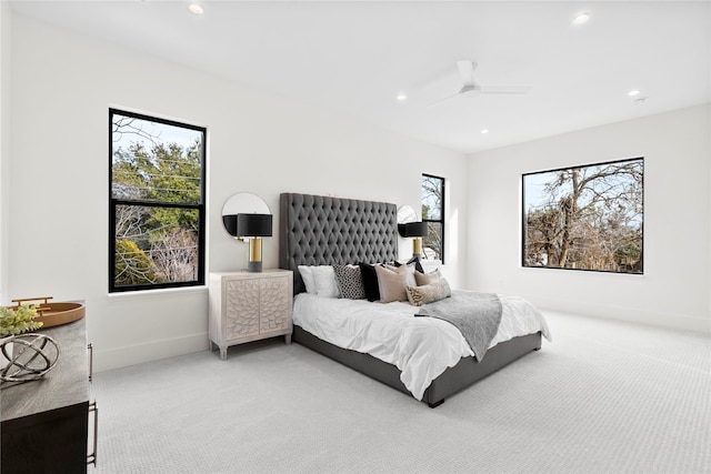 bedroom with multiple windows, carpet, and ceiling fan