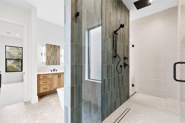 bathroom featuring tile patterned flooring, vanity, and a shower with shower door