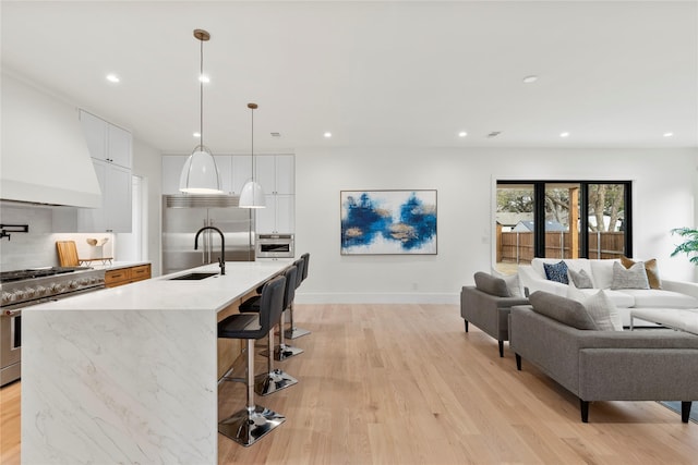 interior space with sink and light hardwood / wood-style floors