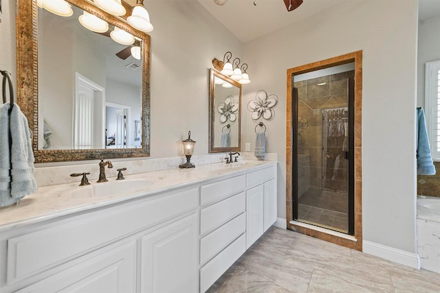 bathroom with walk in shower, ceiling fan, and vanity