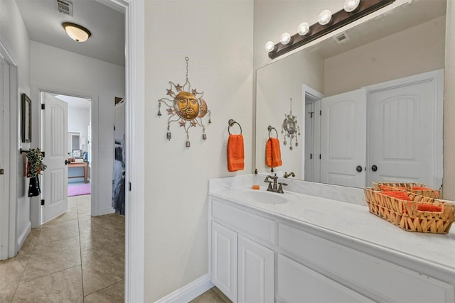 bathroom with vanity and tile patterned flooring