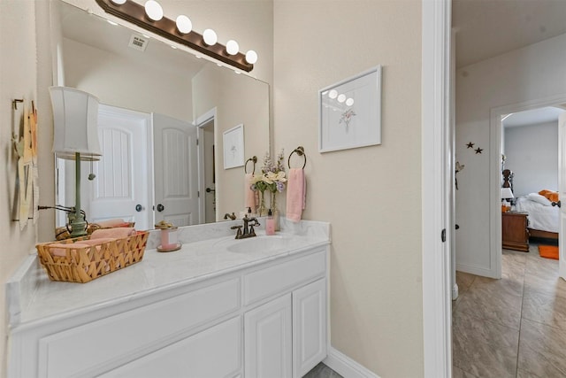 bathroom featuring tile patterned floors and vanity