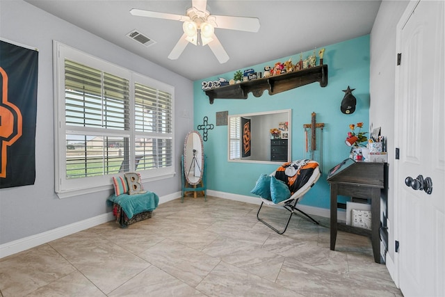 sitting room with ceiling fan