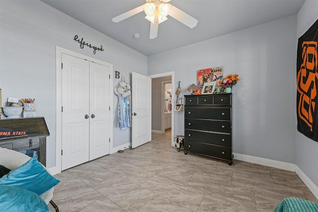 bedroom featuring ceiling fan and a closet