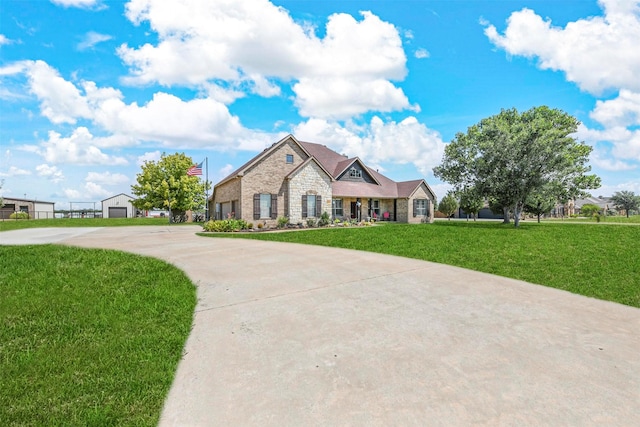 view of front of property featuring a garage and a front lawn