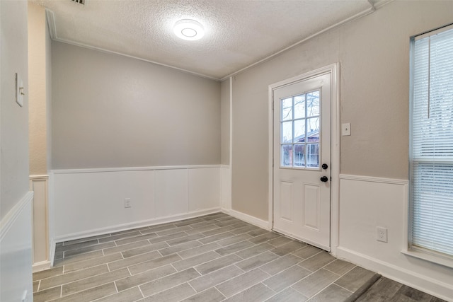 entryway featuring a textured ceiling