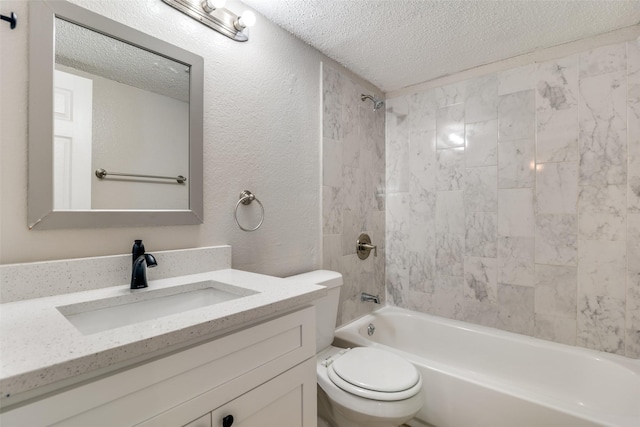 full bathroom with vanity, toilet, tiled shower / bath combo, and a textured ceiling